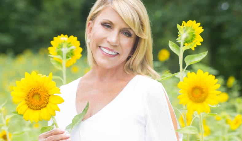 Real patient holding sunflower