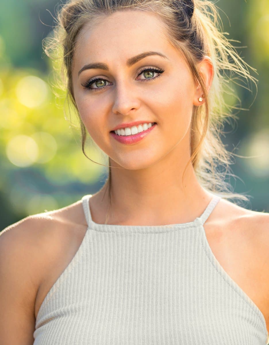 Woman in red swimsuit with smooth, glowing skin