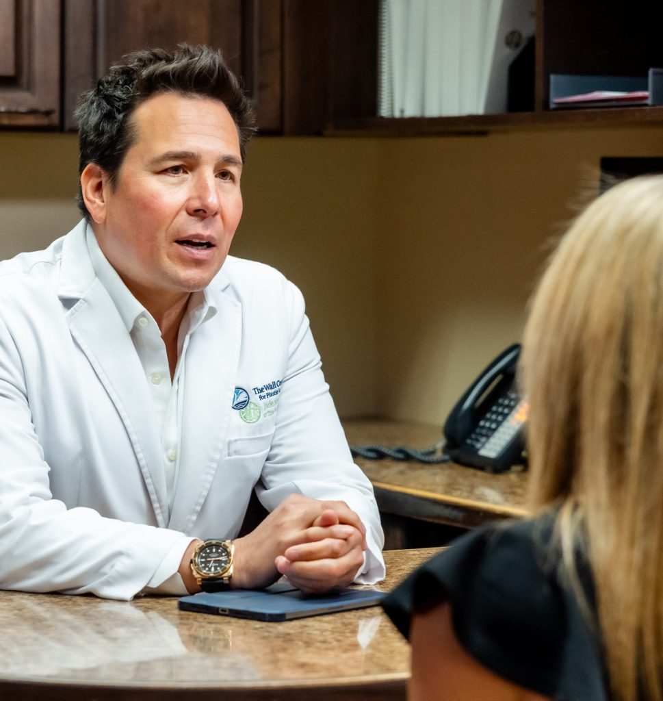 Dr. Simeon Wall Jr. speaking to a patient