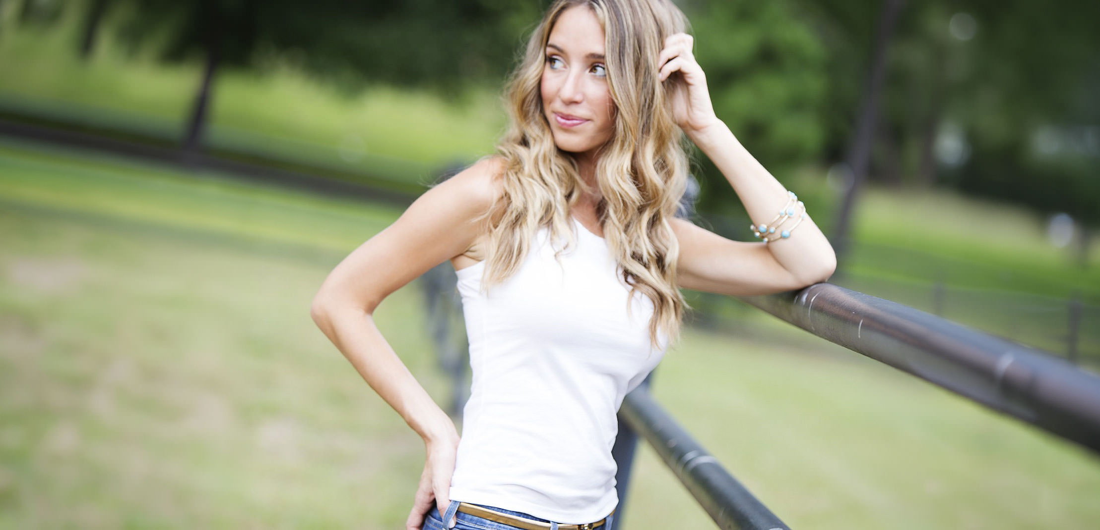 Real patient with slim waistline posing outdoors in casual clothing